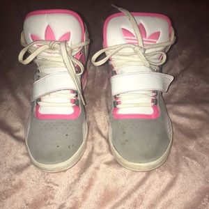 Worn pink and grey adidas